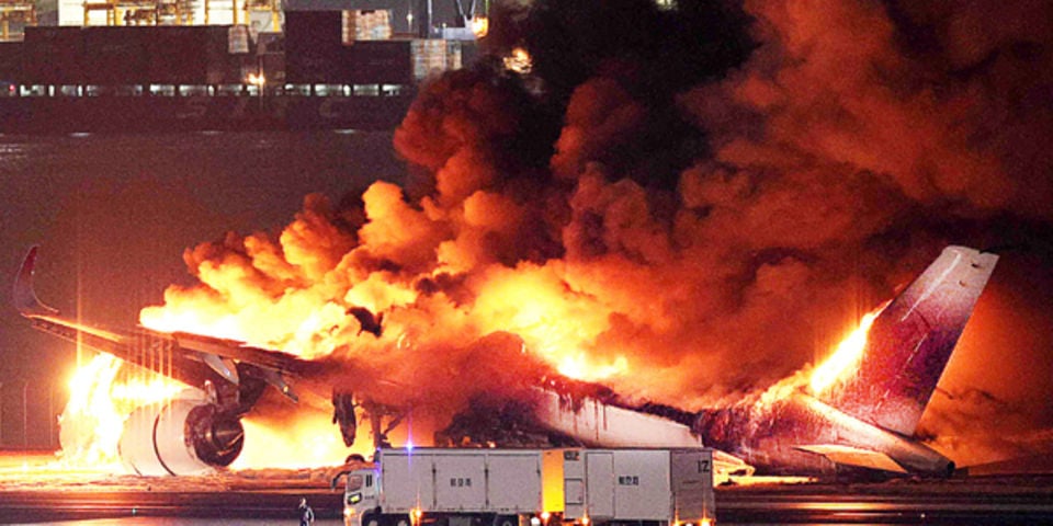 Japan Airlines plane on fire on runway at Tokyo’s Haneda airport